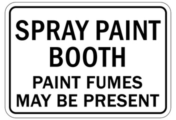 Hazardous fumes sign and labels spray paint booth. Paint fumes may be present