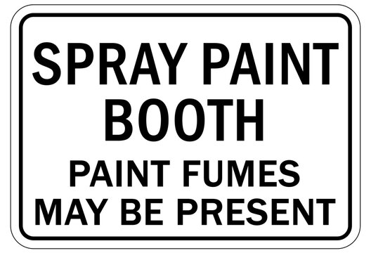 Hazardous fumes sign and labels spray paint booth. Paint fumes may be present