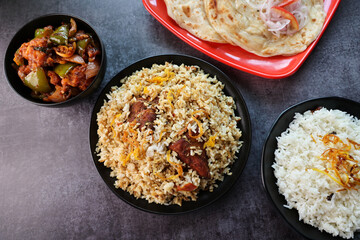 Chicken biryani Spicy Indian Malabar biryani Hyderabadi biryani. Dum Biriyani pulao Kerala India Sri Lanka Pakistan. Basmati rice mixed rice dish with meat curry Ramadan Kareem Eid