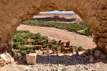 View of Ait Benhaddou through a stone archway in Morocco