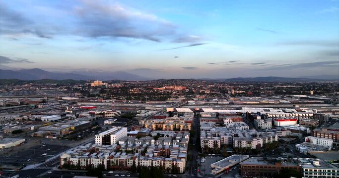 Aerial View of East Los Angeles CA USA at Sunset, Buildings, Street and Bridge Traffic Above LA River Canal