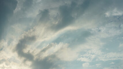 The beautiful sunset sky view with the colorful clouds and warm lights in the sky