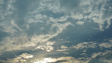 The beautiful sunset sky view with the colorful clouds and warm lights in the sky