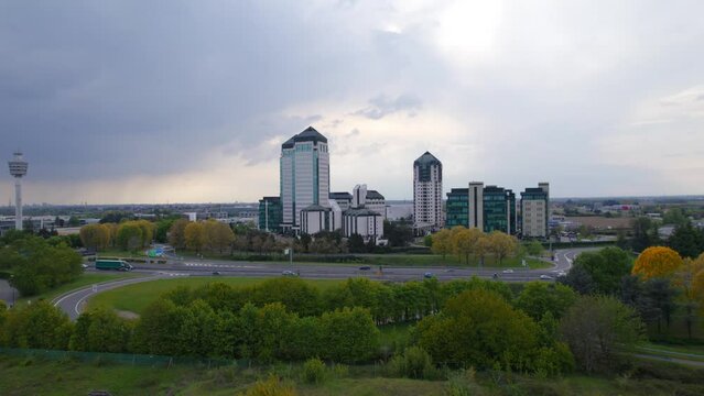 Establisher shot of Vimercate, Torri Bianche cityscapes with modern buildings towers, aerial