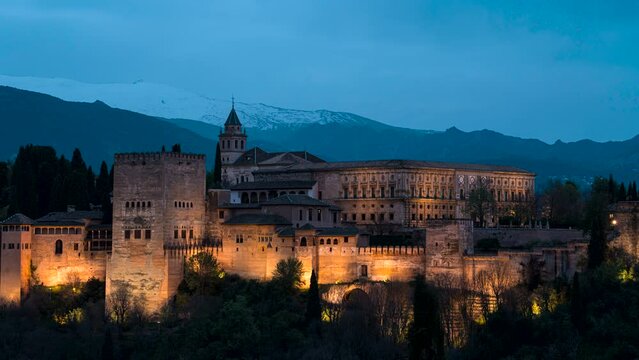 Day to night time lapse - Alhambra Nasrid palace complex illuminated at night