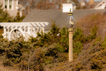 Traditional exterior cape code onion lamp, lantern on post.
