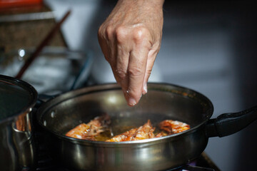 King prawns in a pot in oil
