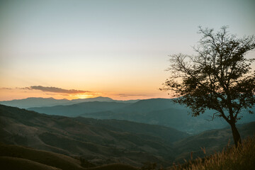 Summer mountains with sunset view of nature cliff mountain.