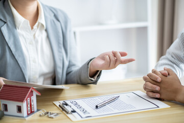 Business people signing contract making deal with real estate agent Concept for consultant home insurance.Real estate investment Property insurance security. Real estate agent offer house
