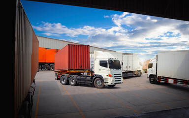 Semi Trailer Trucks on The Parking Lot. Trucks Loading at Dock Warehouse. Shipping Cargo Container Delivery Trucks. Distribution Warehouse. Freight Trucks Cargo Transport. Warehouse Logistics.
