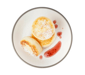 Plate with delicious cottage cheese pancakes isolated on white background