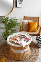 Interior of light hall with armchair and table