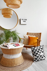 Interior of light hall with armchair and table