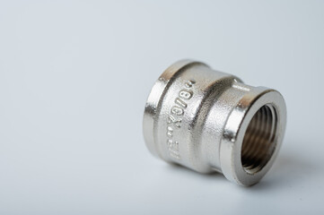 brass metal tee water adapters isolated on light background close up plumbing connections and details