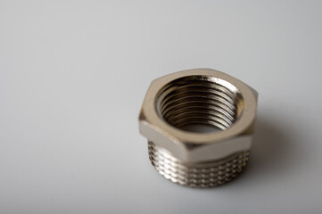 brass metal tee water adapters isolated on light background close up plumbing connections and details