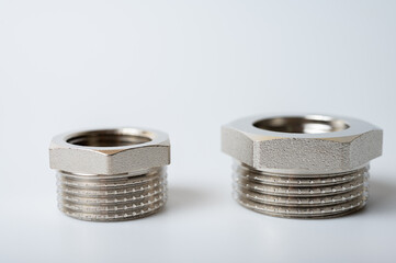 brass metal tee water adapters isolated on light background close up plumbing connections and details