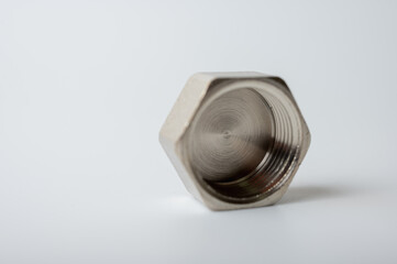 brass metal plugs for hex key for water isolated on light background close up plumbing connections and parts