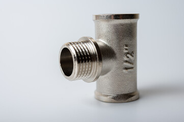 brass metal tee water adapters isolated on light background close up plumbing connections and details