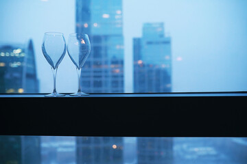 Cocktail glasses on the windowsill by the glass