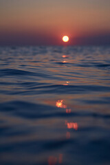 Setting sun reflecting in north sea water. High quality photo