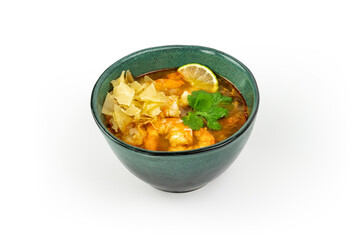 Tom Yam Kung soup with shrimps in ceramic green bowl isolated on white