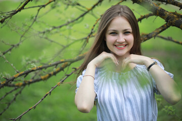 A girl in a spring green park