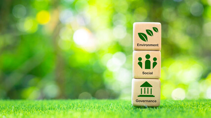 ESG on wooden blocks and future environmental conservation and sustainable modernization of ESG by taking into account responsibility in 3 main areas: environment, society and governance.