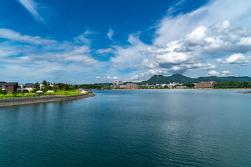 Fototapeta na wymiar Park and residential area is beside a bay on the outskirts of Fukuoka City, JAPAN.