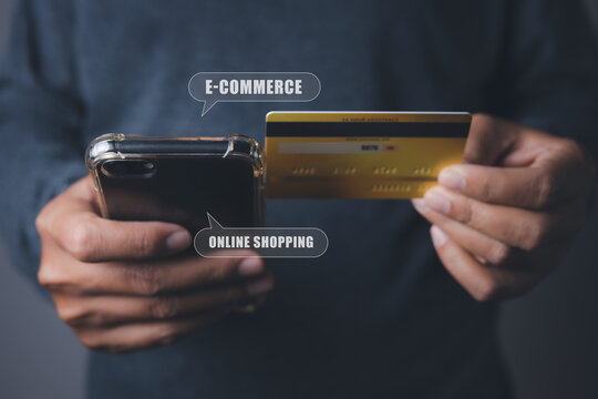 Businessman using mobile phone and credit card shopping online.