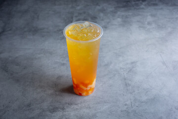 A view of a peach green tea beverage.