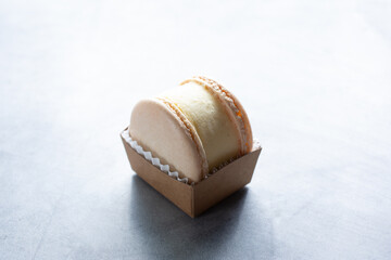 Fototapeta na wymiar A view of a vanilla macaron ice cream sandwich.