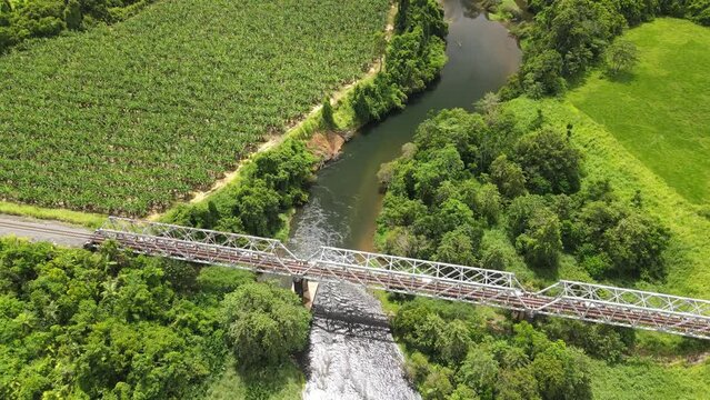 Cinematic aerial footage of Russell River crossing the Bruce Hwy south of Cairns Queensland Australia