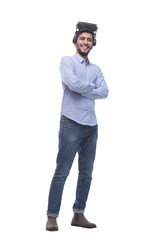 Naklejka premium in full growth. confident young man in virtual reality glasses.