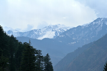 Snow capped peak in the middle of the frame