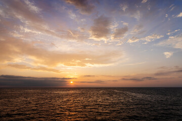 Naklejka na ściany i meble Colorful sunset over ocean