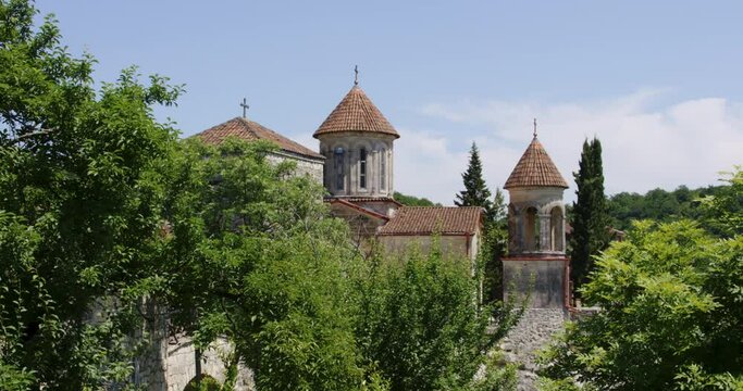 Motsameta orthodox monastery hidden in forest trees in Georgia.