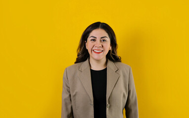 young hispanic business woman posing isolated over yellow background in Mexico Latin America