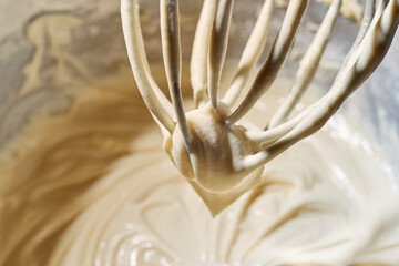 cheesecake dough on whisk tip