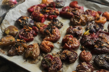 colored potatoes baked whole on a baking sheet in crushed form, delicious potatoes