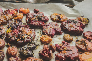 colored potatoes baked whole on a baking sheet in crushed form, delicious potatoes