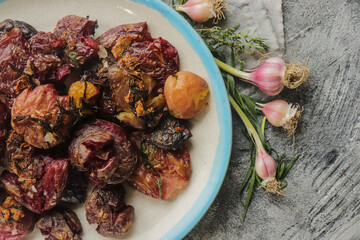 colored potatoes baked whole on a baking sheet in crushed form, delicious potatoes