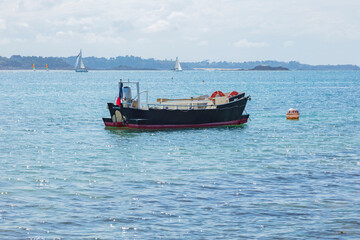 boat on the water with the inscription St Malo, France