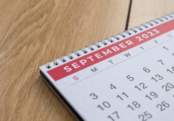 Closeup shot of a 2023 calendar, "September page". Selective focus shot of a calendar, focused on "September, 2023".