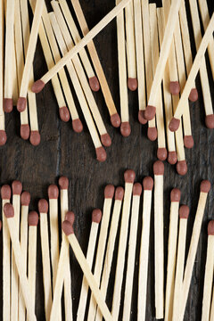 Overhead view of matchsticks on wooden table