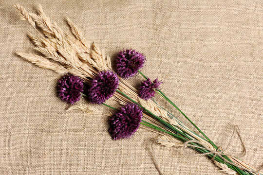 High angle view of flowers and plants tied on burlap