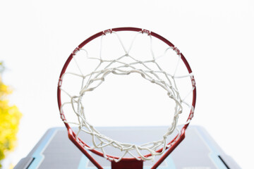 Low angle view of basketball hoop against clear sky in backyard
