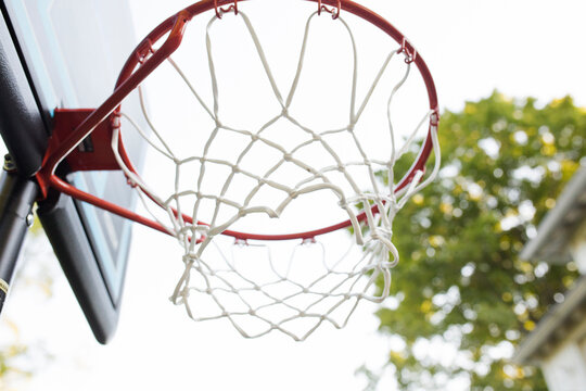 Low angle view of basketball hoop against clear sky in yard