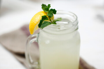 Close-up of lemonade in jar on table