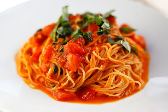 High angle close-up of spaghetti served in plate on table