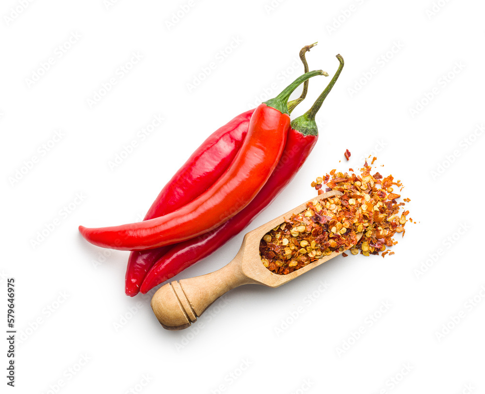 Sticker dry chili pepper flakes in wooden scoop. crushed red peppers isolated on white background.